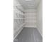 Walk-in closet with adjustable shelving and hanging space provides ample storage at 9148 Oak Knoll Ln, Fishers, IN 46037