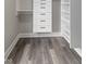 Custom closet with built in shelves and drawers provide plentiful storage in this tidy space at 9148 Oak Knoll Ln, Fishers, IN 46037