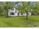 Beautiful white brick home featuring black shutters and a well-maintained lawn at 9148 Oak Knoll Ln, Fishers, IN 46037