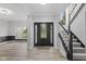Spacious foyer boasts hardwood floors and an elegant staircase with carpeted steps at 9148 Oak Knoll Ln, Fishers, IN 46037