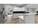 Bright kitchen with white cabinets, a marble countertop, and stainless steel appliances at 9148 Oak Knoll Ln, Fishers, IN 46037