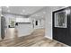 Open living space features modern finishes, wood-look floors, and ample natural light at 9148 Oak Knoll Ln, Fishers, IN 46037