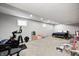 Finished basement with carpet, exercise equipment, a bed, and toys at 10717 Windermere Blvd, Fishers, IN 46037