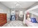 Cozy bedroom showcasing a white canopy bed, a chair, a play tent, and a white/black patterned rug at 10717 Windermere Blvd, Fishers, IN 46037