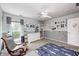 bedroom with a chair, a white dresser, and a name decal on the wall above the dresser at 10717 Windermere Blvd, Fishers, IN 46037