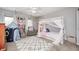 Bedroom featuring a white canopy bed, a chair, a star tent, and an area rug at 10717 Windermere Blvd, Fishers, IN 46037