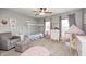 This bedroom features carpeted floors, a custom bed frame, and natural light through two windows at 10717 Windermere Blvd, Fishers, IN 46037