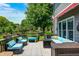 Outdoor deck featuring comfortable seating and a decorative patterned rug perfect for relaxing and entertaining at 10717 Windermere Blvd, Fishers, IN 46037
