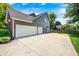 Spacious three-car garage and driveway with basketball hoop, set against a well-maintained exterior at 10717 Windermere Blvd, Fishers, IN 46037