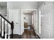 Hallway that showcases an office with natural light and a modern chandelier at 10717 Windermere Blvd, Fishers, IN 46037