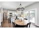 Eat-in kitchen with black countertops, and access to outdoor dining at 10717 Windermere Blvd, Fishers, IN 46037