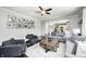 Open-concept living room with hardwood floors, fireplace and ample seating at 10717 Windermere Blvd, Fishers, IN 46037