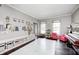 Bright and spacious playroom with ample storage, decorative wall art, and a play area rug at 10717 Windermere Blvd, Fishers, IN 46037