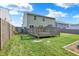 Spacious backyard featuring a well-maintained lawn, deck, and ample space for outdoor activities at 10902 Jimmy Lake Dr, Indianapolis, IN 46239