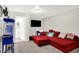 Finished basement featuring gray carpet, bathroom access, plus a red sectional for comfortable movie nights at 10902 Jimmy Lake Dr, Indianapolis, IN 46239