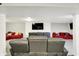 Finished basement boasts a theater setup with comfortable seating and accent wall for an immersive experience at 10902 Jimmy Lake Dr, Indianapolis, IN 46239