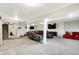 Spacious finished basement boasts gray carpet, TV area and comfortable seating, perfect for movie nights at 10902 Jimmy Lake Dr, Indianapolis, IN 46239