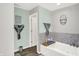 The bathroom features a modern soaking tub and tile accents at 10902 Jimmy Lake Dr, Indianapolis, IN 46239