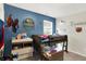 A well-lit bedroom featuring a bunk bed with a window view and playful superhero decor at 10902 Jimmy Lake Dr, Indianapolis, IN 46239