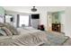 This carpeted bedroom has a king bed and an entertainment area with a dresser and tv at 10902 Jimmy Lake Dr, Indianapolis, IN 46239