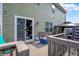 Back deck with sliding glass door and outdoor seating provides space to enjoy the outdoors in comfort and style at 10902 Jimmy Lake Dr, Indianapolis, IN 46239