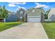 Two-story home with a brick and siding exterior and a concrete driveway at 10902 Jimmy Lake Dr, Indianapolis, IN 46239