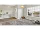 Inviting entryway with modern decor, a decorative rug, and a bright window at 10902 Jimmy Lake Dr, Indianapolis, IN 46239