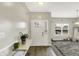 Inviting entryway with modern decor, a decorative rug, and a glass table at 10902 Jimmy Lake Dr, Indianapolis, IN 46239