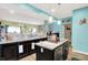 Kitchen boasts an island with sink, pendant lighting, and an open floor plan at 10902 Jimmy Lake Dr, Indianapolis, IN 46239