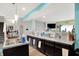 Bright kitchen featuring white countertops, an island with sink, and open floor plan at 10902 Jimmy Lake Dr, Indianapolis, IN 46239