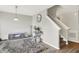 Stylish living room with a decorative rug, staircase and modern decor at 10902 Jimmy Lake Dr, Indianapolis, IN 46239