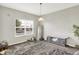 Modern living room featuring a large window, stylish rug, and decorative accents at 10902 Jimmy Lake Dr, Indianapolis, IN 46239