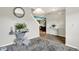 Open-concept living room featuring stylish decor and a view into the kitchen at 10902 Jimmy Lake Dr, Indianapolis, IN 46239