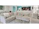 Open concept living area featuring a large sectional and connection to dining area at 10902 Jimmy Lake Dr, Indianapolis, IN 46239