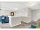 Bright loft space with comfortable seating and a modern chandelier at 10902 Jimmy Lake Dr, Indianapolis, IN 46239