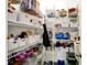 Pantry features shelves and a variety of food items in organized containers at 10902 Jimmy Lake Dr, Indianapolis, IN 46239