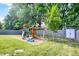 A backyard playground, including swings and a slide, sits next to a storage shed at 10902 Jimmy Lake Dr, Indianapolis, IN 46239