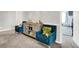 Sitting area with comfy blue chairs, accent table, and doorway to another room at 10902 Jimmy Lake Dr, Indianapolis, IN 46239