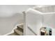 Carpeted staircase leading to the lower level of the home with neutral colored walls at 10902 Jimmy Lake Dr, Indianapolis, IN 46239
