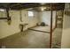 Unfinished basement with concrete floors and walls ready for renovation at 1115 N Kealing Ave, Indianapolis, IN 46201