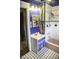 Cute bathroom featuring tiled walls, a combination shower and bath, and a charming vanity at 1115 N Kealing Ave, Indianapolis, IN 46201