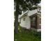 Home exterior featuring a yard, brick facade and white aluminum siding at 1115 N Kealing Ave, Indianapolis, IN 46201