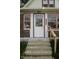 Close-up of the front entrance, showing the house number, stylish door, and steps at 1115 N Kealing Ave, Indianapolis, IN 46201