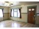 Bright living room featuring hardwood floors, charming windows, and decorative trim at 1115 N Kealing Ave, Indianapolis, IN 46201