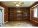 Spacious living room features large built-in shelving and natural light from the window at 1115 N Kealing Ave, Indianapolis, IN 46201
