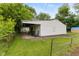 Detached garage with covered porch and outdoor seating at 1116 N Berwick Ave, Indianapolis, IN 46222