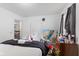 Bright bedroom featuring a television, comfortable bed, and a window for natural light at 1116 N Berwick Ave, Indianapolis, IN 46222