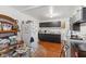 View of kitchen featuring white refrigerator, dark cabinets, and dining table for seating at 1116 N Berwick Ave, Indianapolis, IN 46222