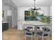 Dining room with chandelier, painting, and plant, complemented by hardwood floors at 1120 Terrace Lake Rd, Columbus, IN 47201
