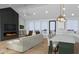 Open-concept living room with fireplace, island, and large windows offering an airy feel at 1120 Terrace Lake Rd, Columbus, IN 47201
